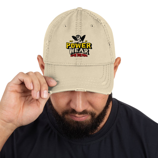 Beige cap with Power Wear logo held by a person against a white background